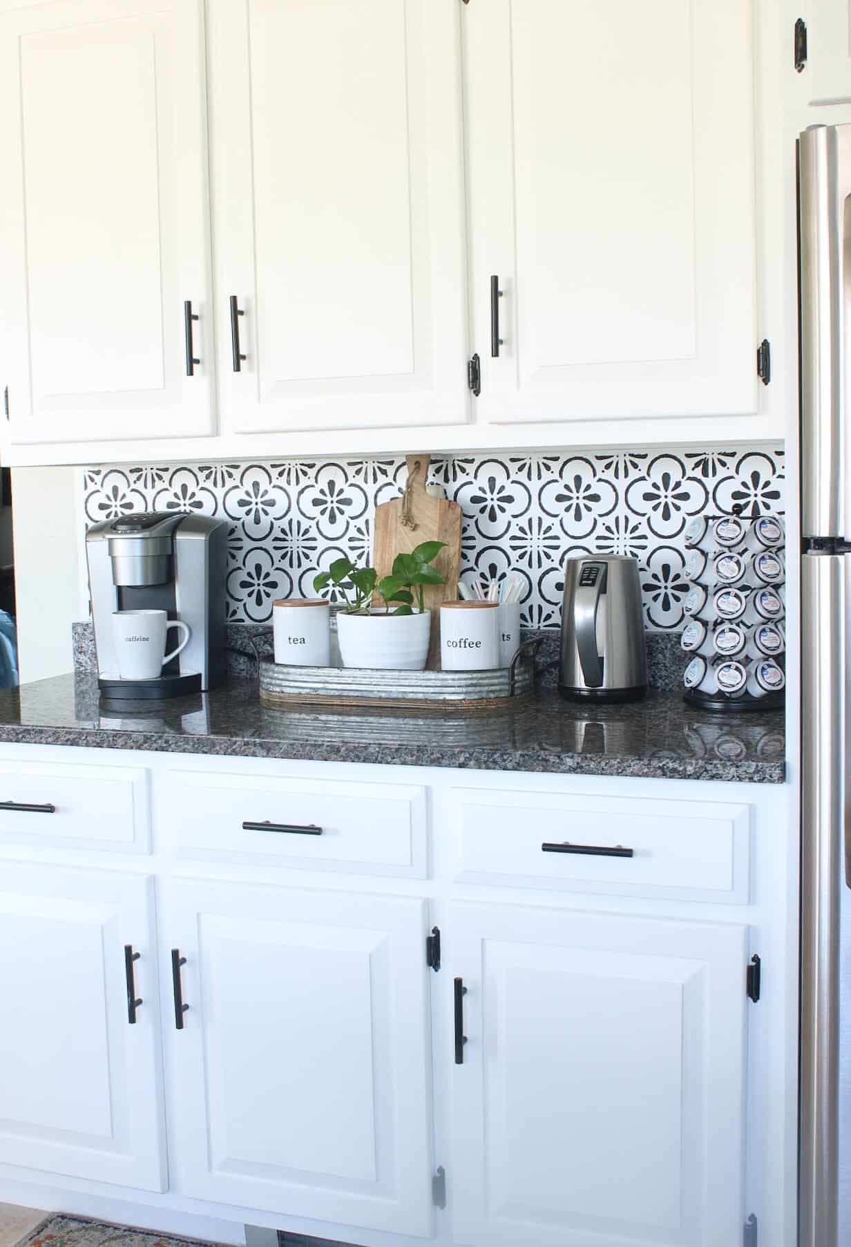 white kitchen cabinets w/ black handles