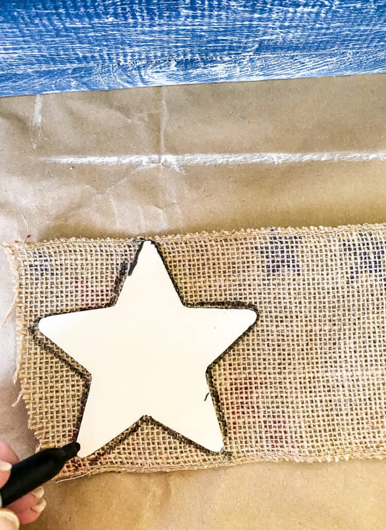 tracing stars on burlap ribbon
