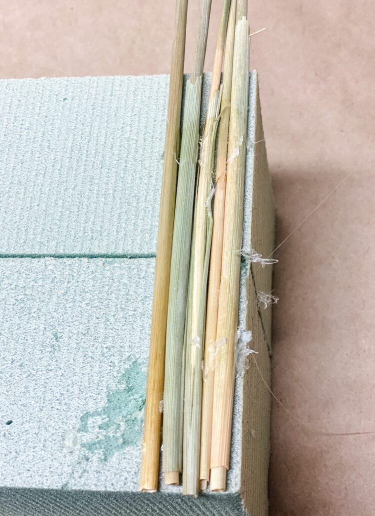 gluing wheat to floral foam
