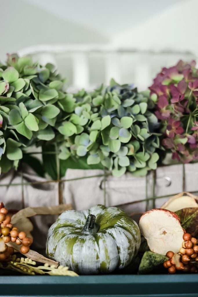 hydrangeas and pumpkins on hutch