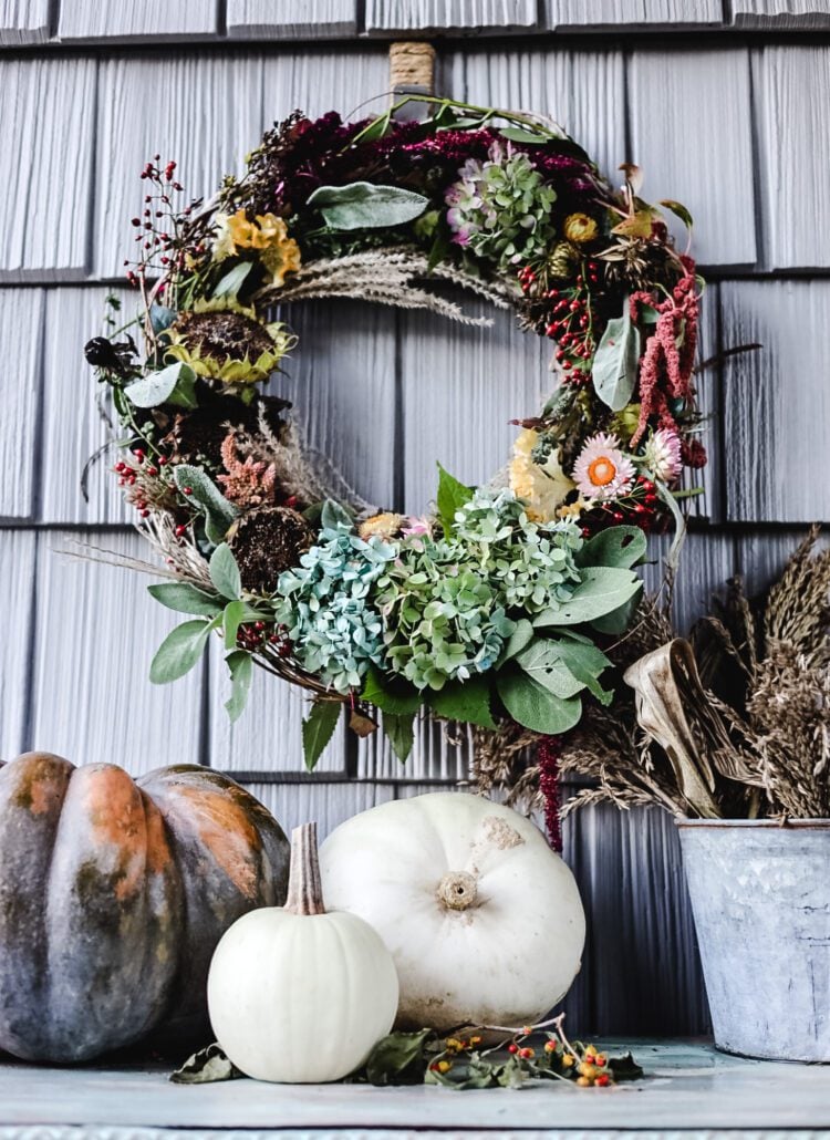 A Fall Dried flower wreath with pumpkins