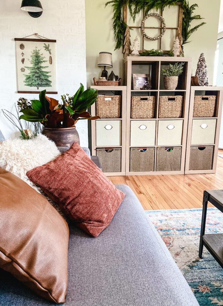 gray sectional with rust and faux leather pillows