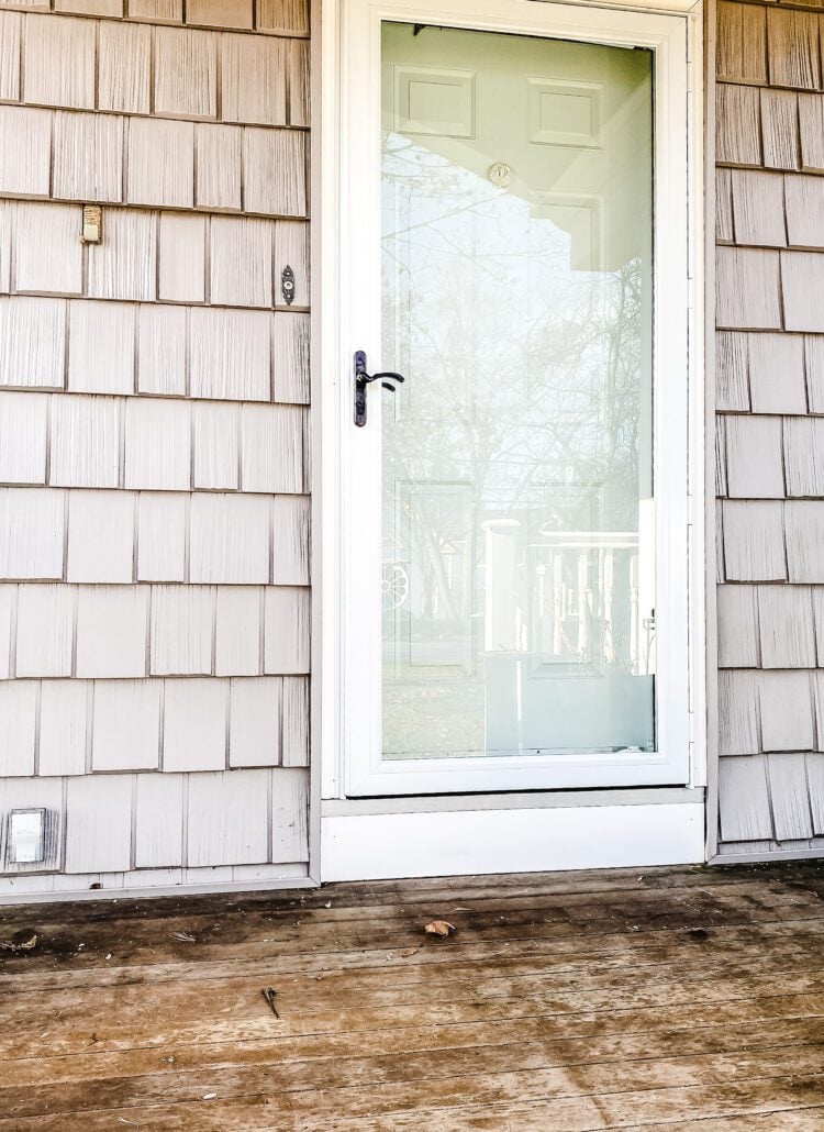 gray house with blue door