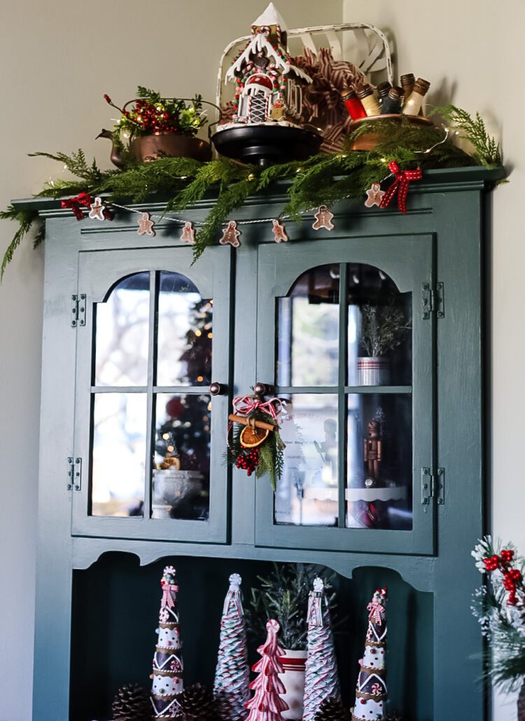green kitchen hutch decorated for Christmas