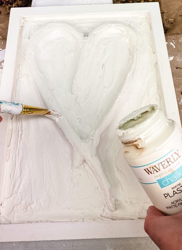 painting a clay heart 