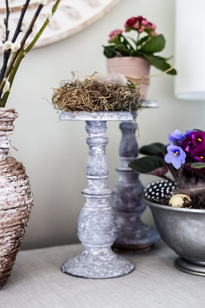 candlestick with mini bird's nest on top