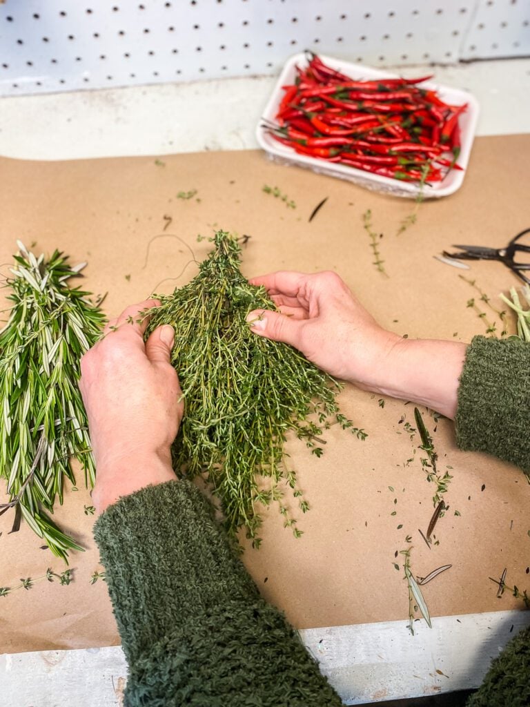 making an herb bundle by tying floral wire