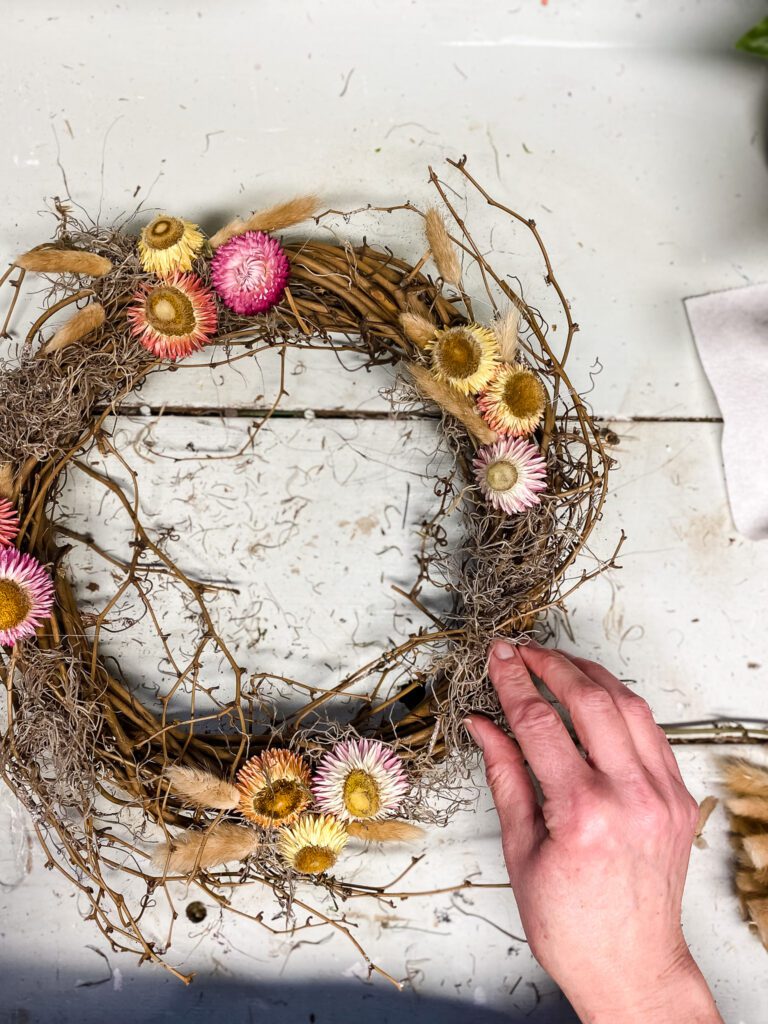 dried flower wreath story-adding moss