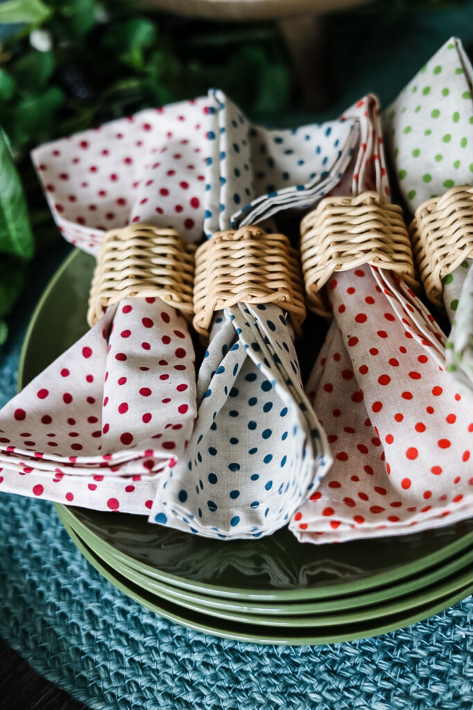 different colored polka dot napkins with rattan napkin rings