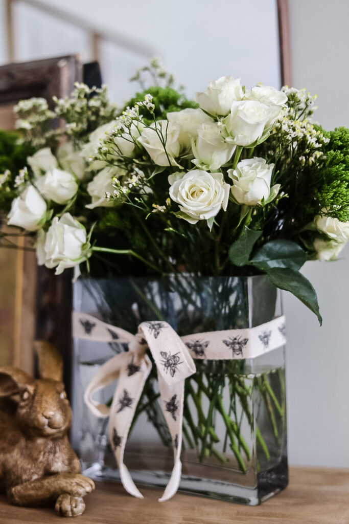 white rose arrangement in glass vase