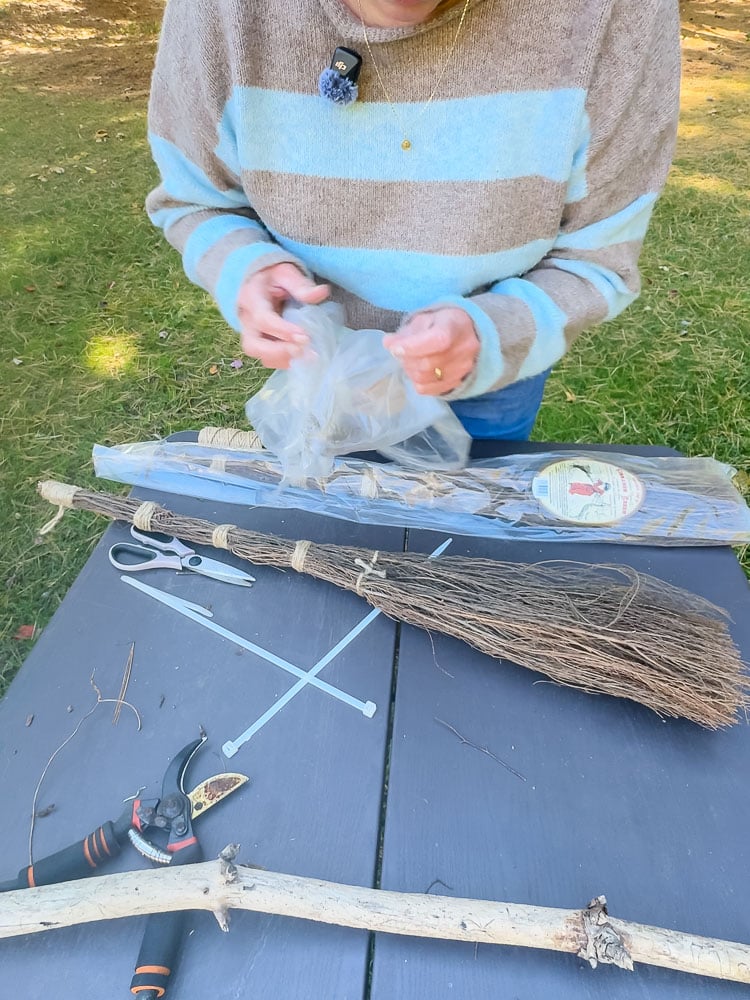 making a witch broom with cinnamon brooms and stick