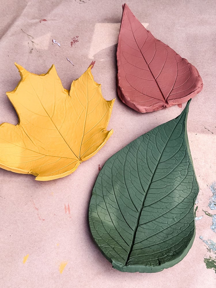 clay shaped leaves painted in fall colors