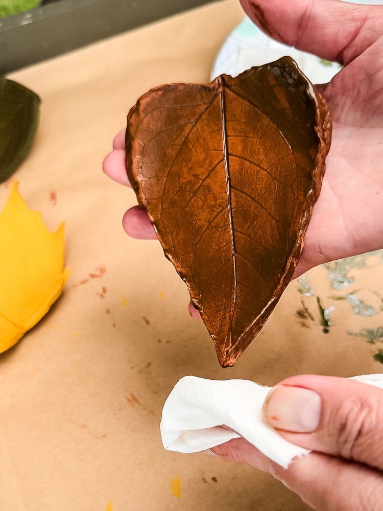 wiping wax off of clay leaf shape