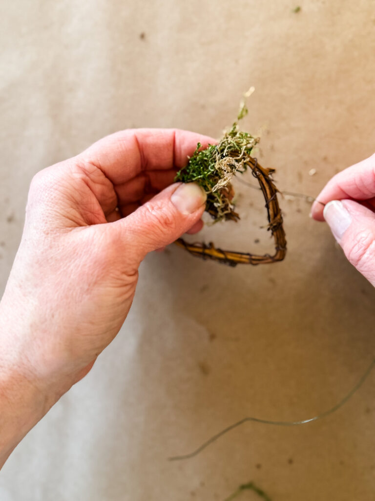 wiring moss on a grapevine heart