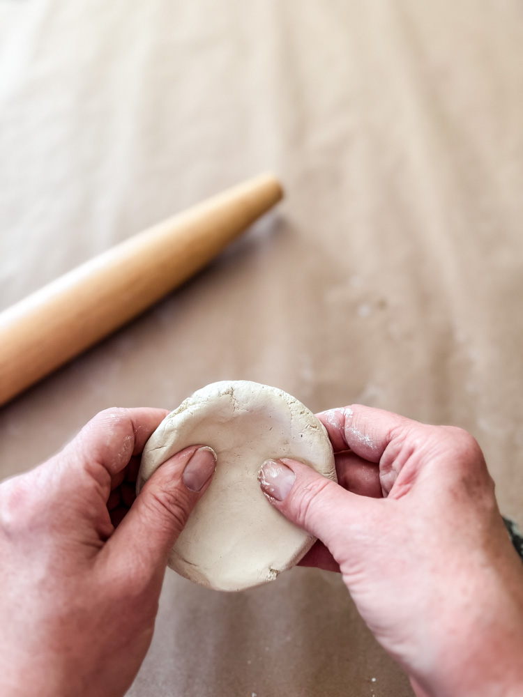 shaping clay into a mushroom shape