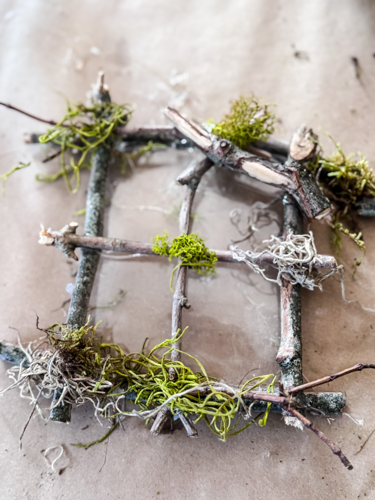 fairy tree window made with twigs and moss, use clear plastic for the window glass