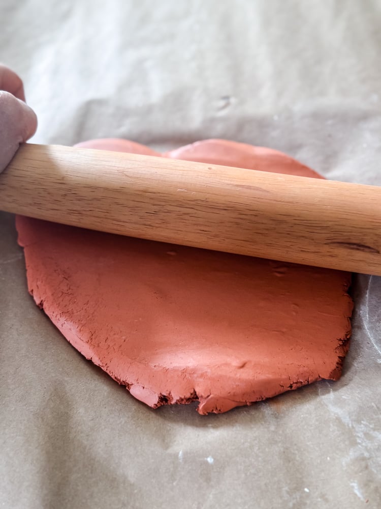 rolling clay with a pastry roller