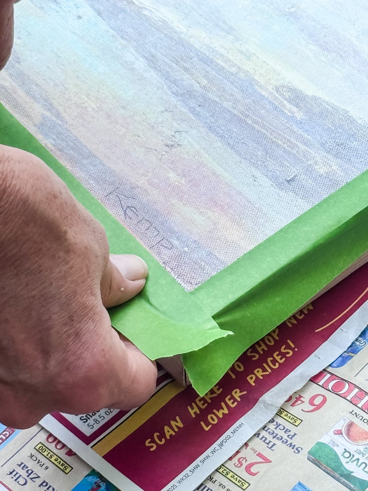 taping off a frame to paint