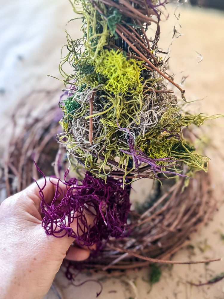 adding colorful moss to a witch hat diy project