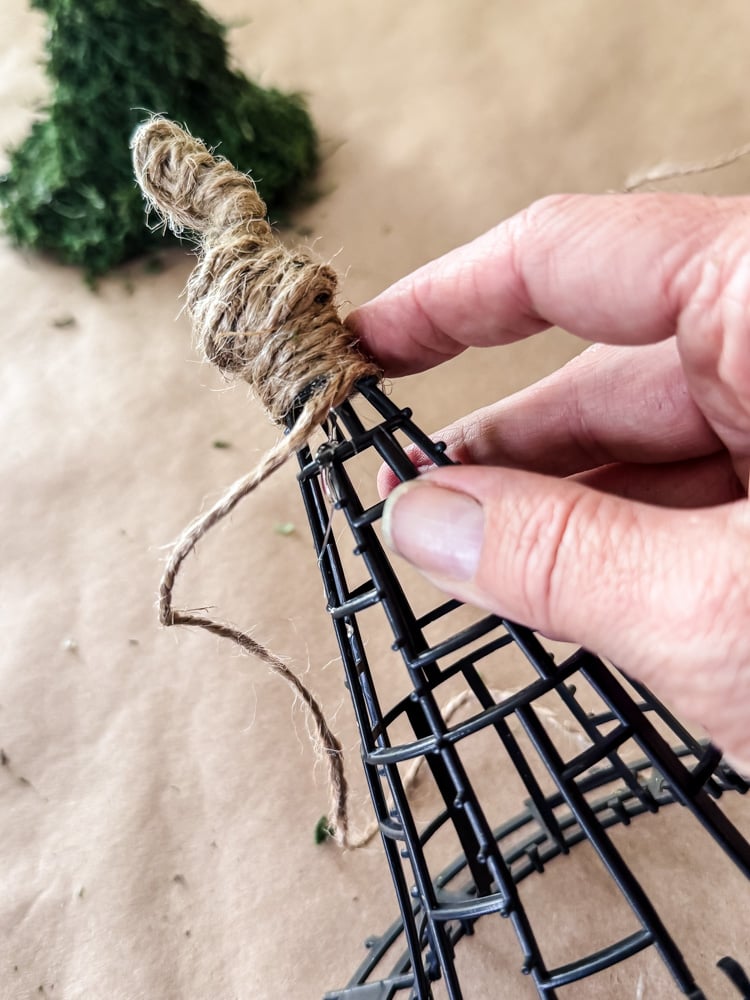wrapping jute twine around a plastic witch hat