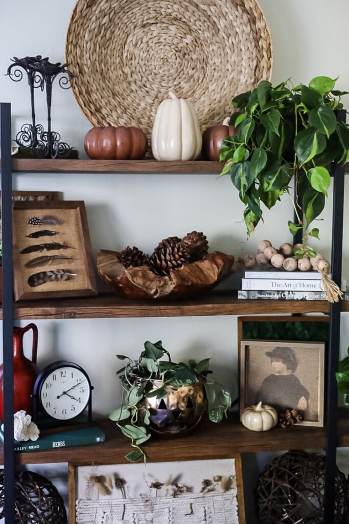 bookcase styled for fall