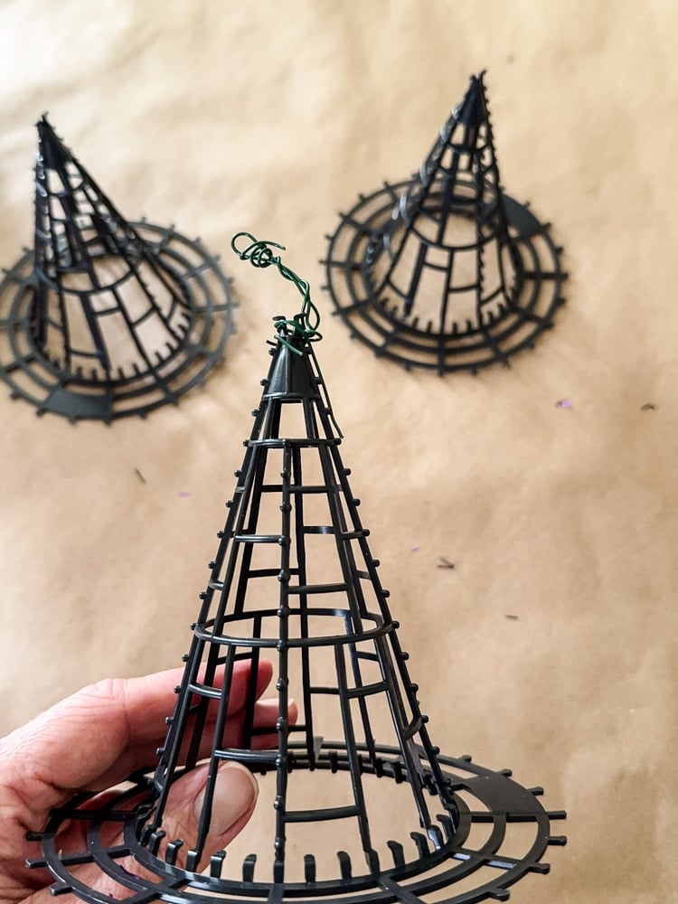 making witch hat topiaries, shown are 3 plastic witch hat bases made of plastic