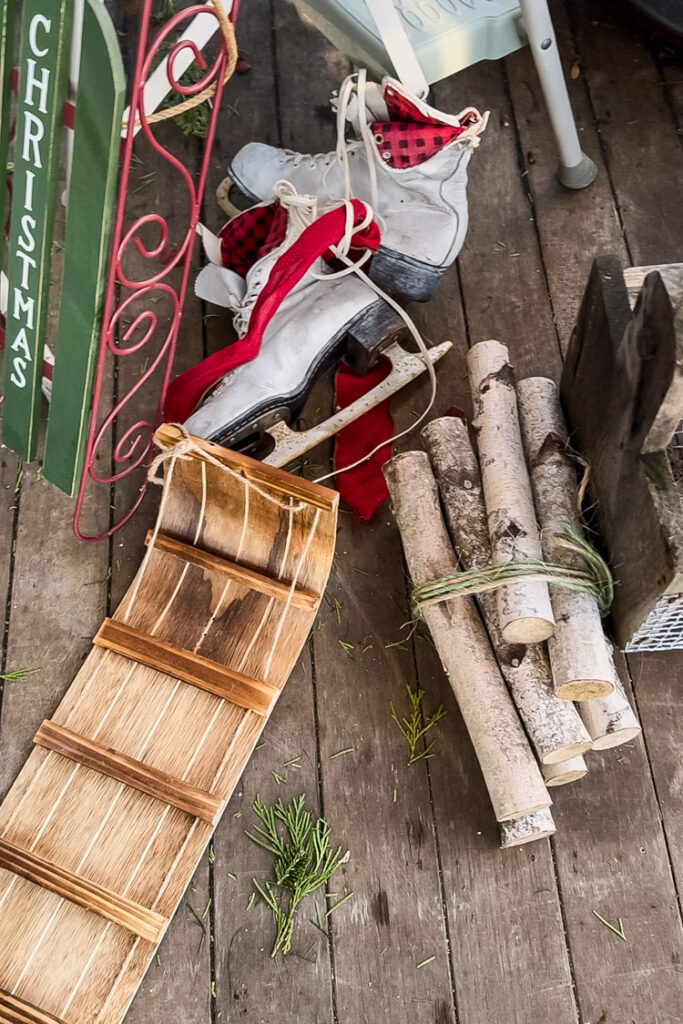 pile of christmas decor to be used to decorate a porch