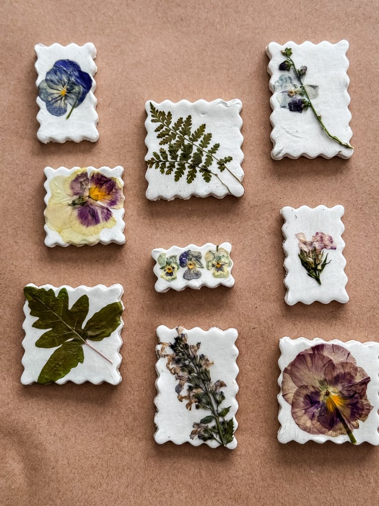 pressed flower magnets shaped like postage stamps