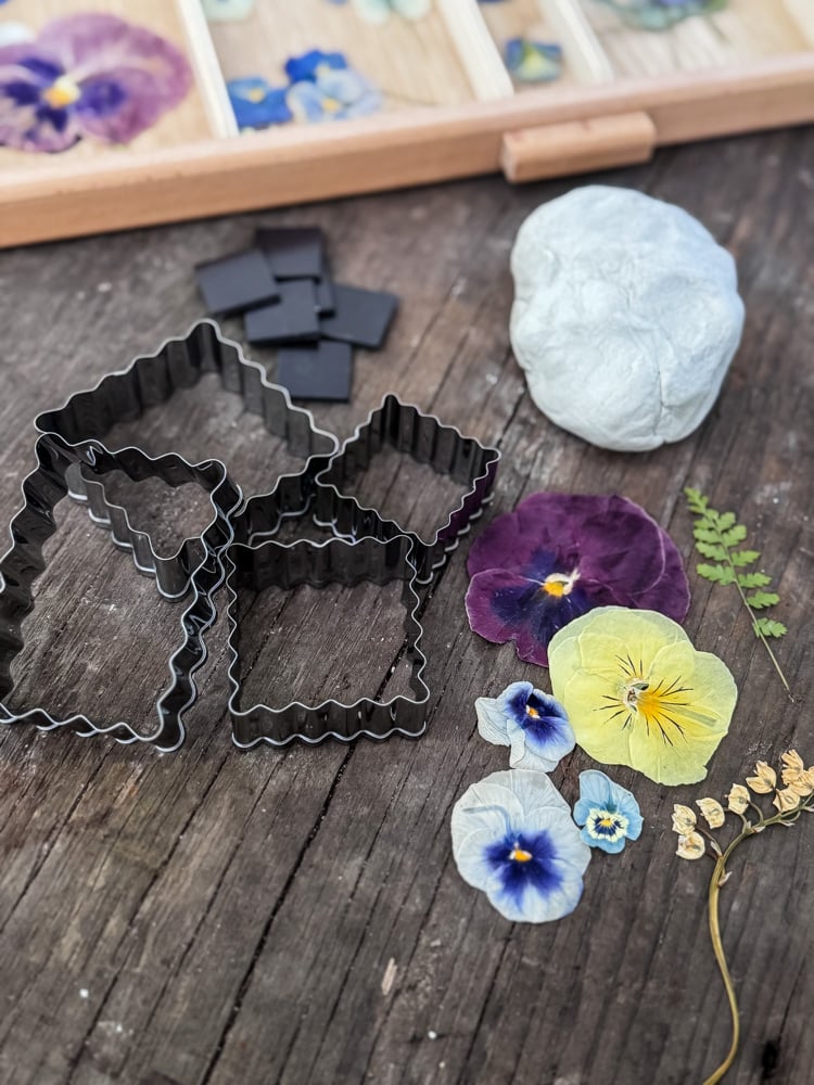 pressed pansies, cookie cutters, clay