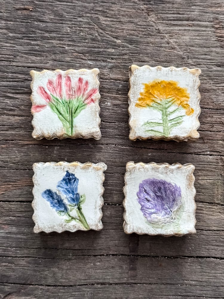 4 clay magnets with flowers painted