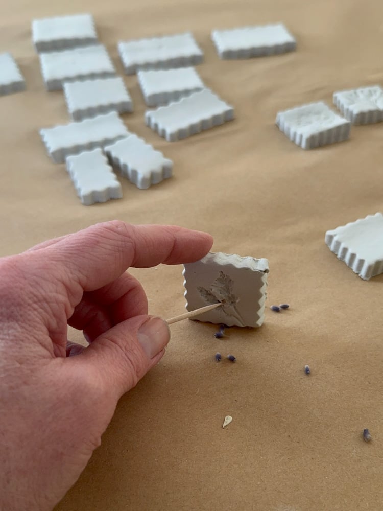 using toothpick to remove flower debris from clay