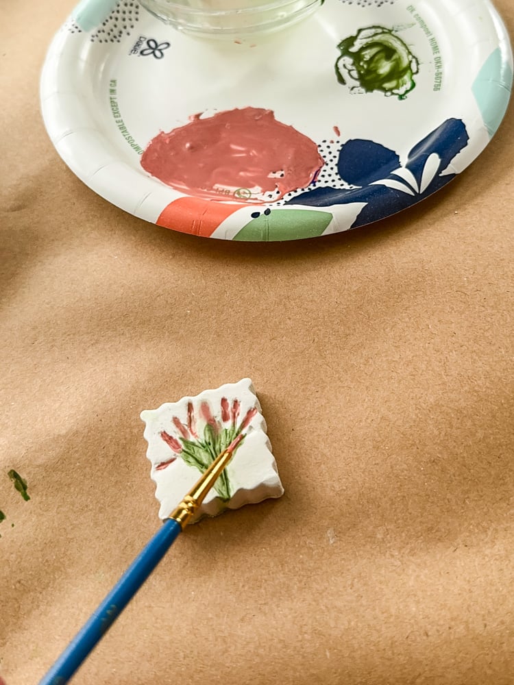 watercoloring clay magnets with flower impression
