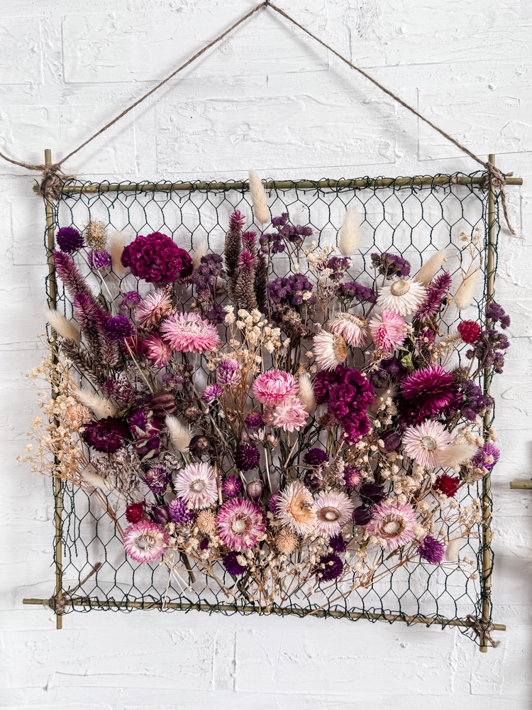 colorful dried flowers in a hanging frame
