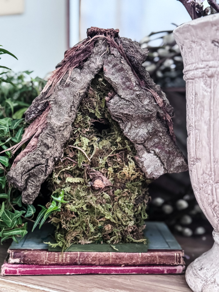 moss covered birdhouse