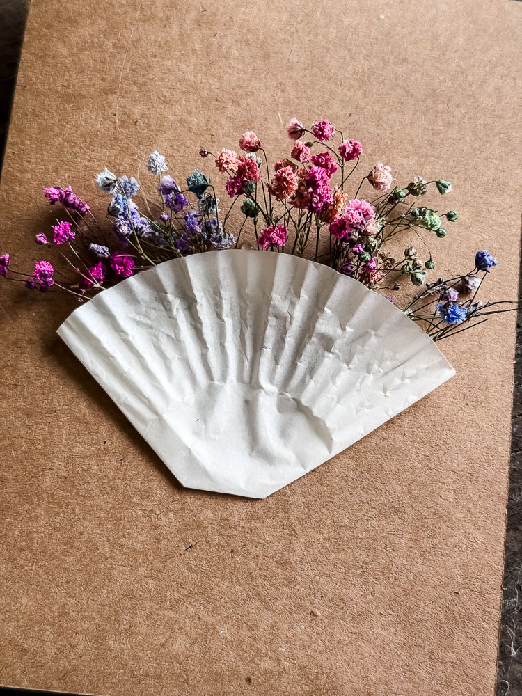 colorful baby's breath in a cupcake liner on the front of a card