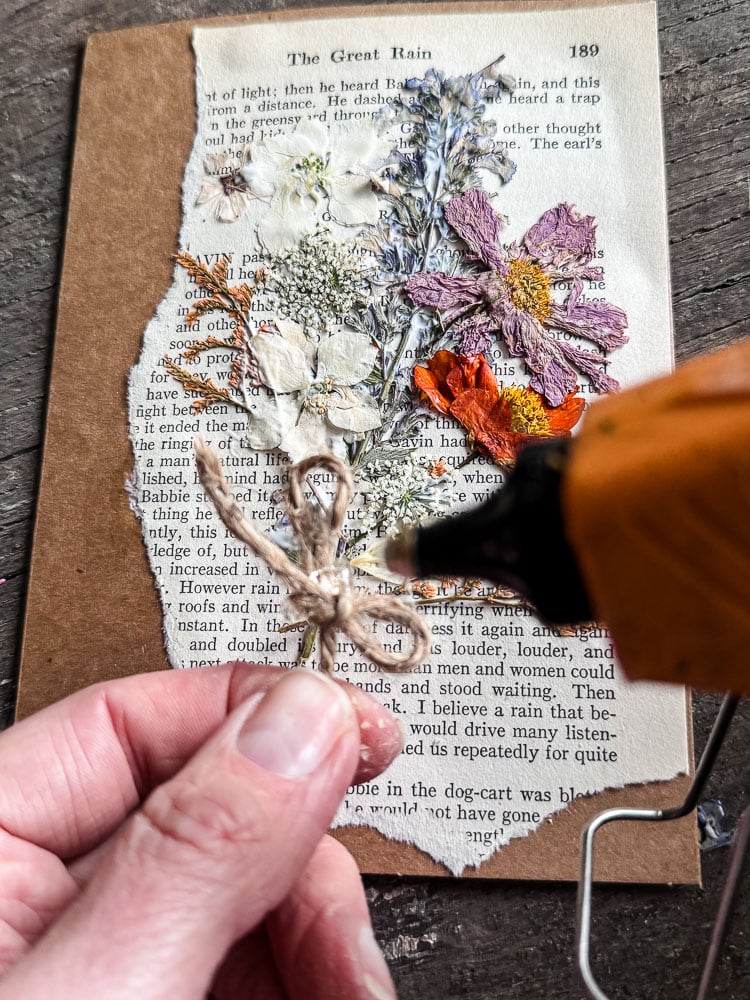 hot gluing a piece of jute twine