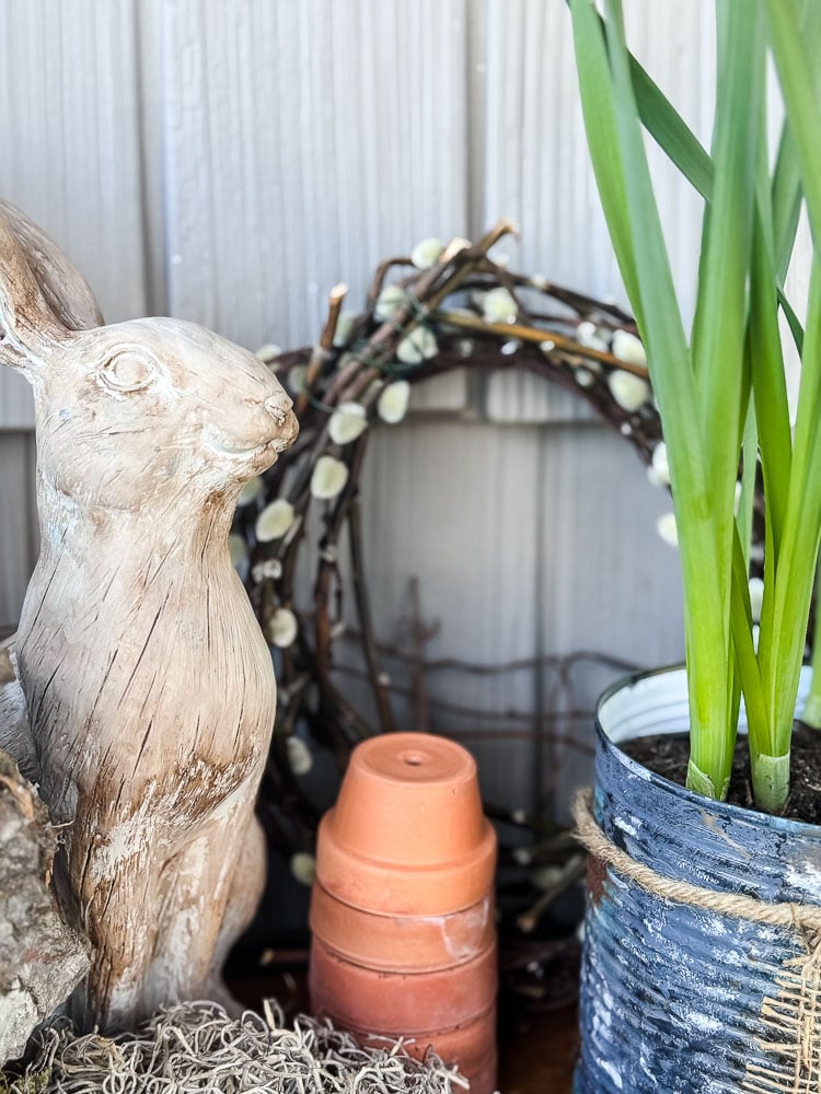spring display with bunny, wreath, and pot of tulips