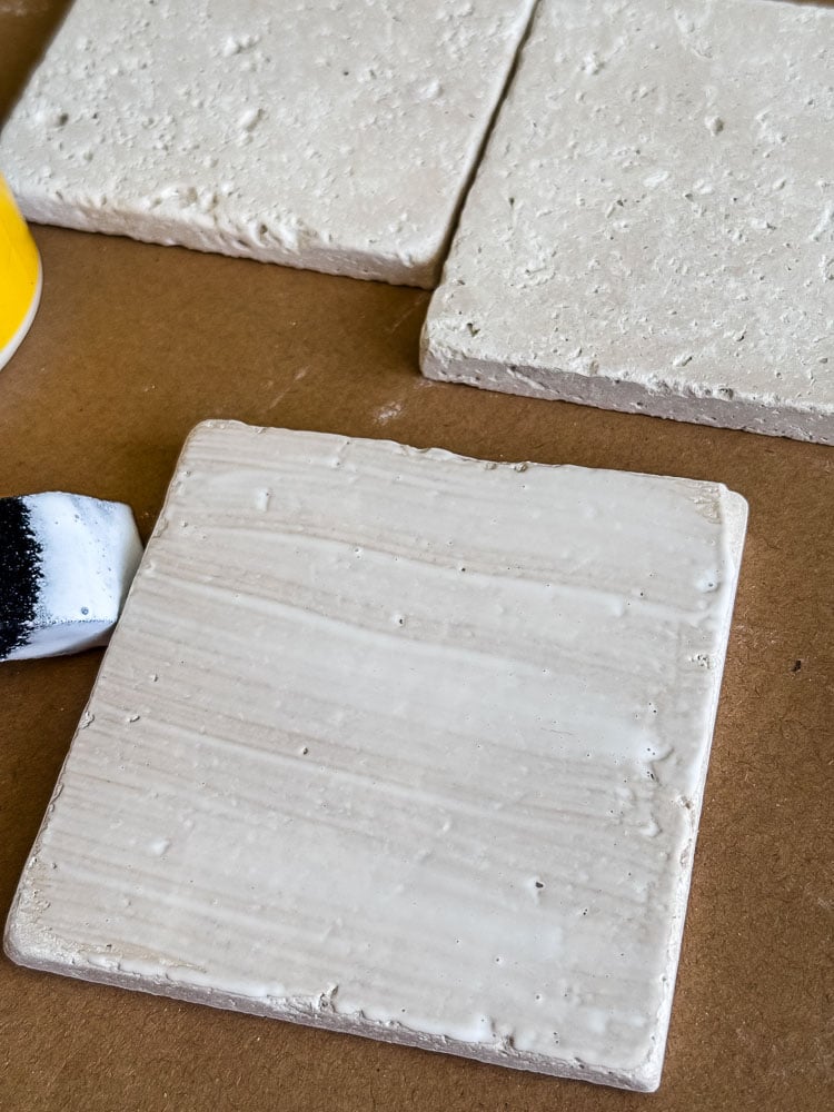 brushing mod podge on top of tile