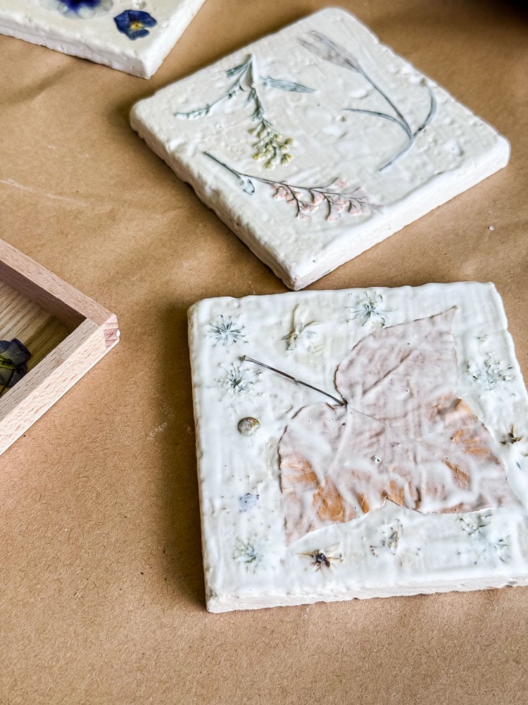 making tile coasters with decoupaged flowers on top