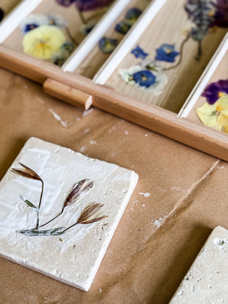 making a coaster with flowers on top