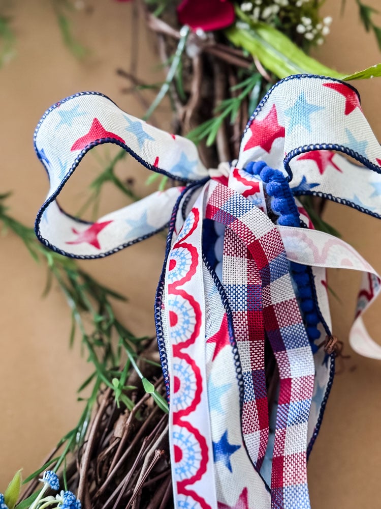 red,white, blue bow on a wreath
