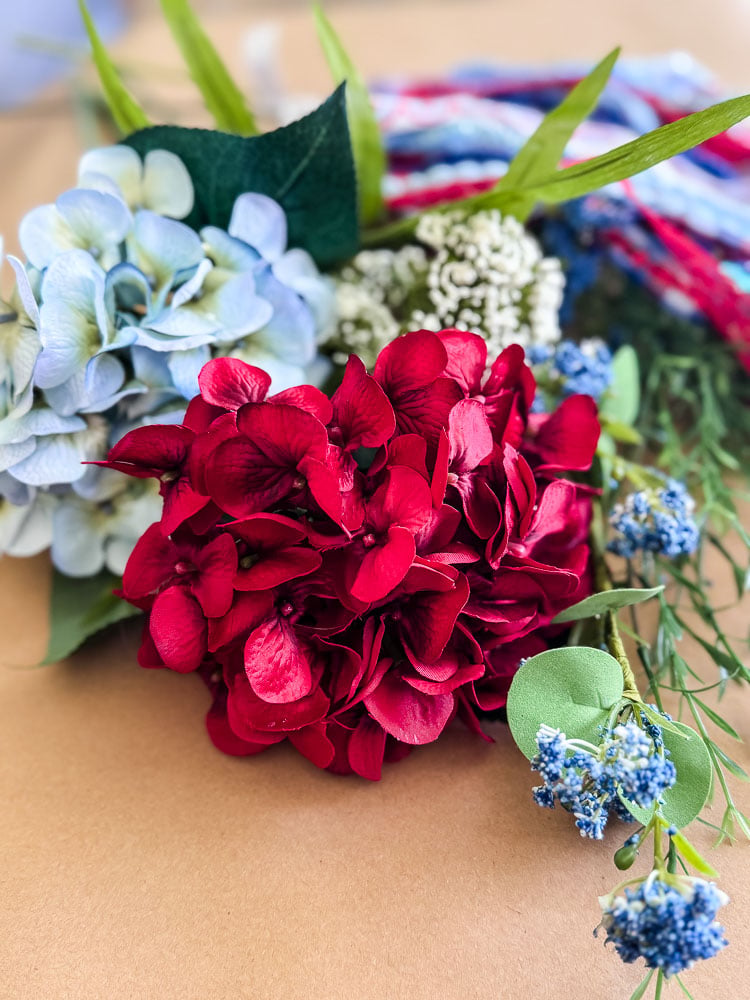red, white, blue faux flowers
