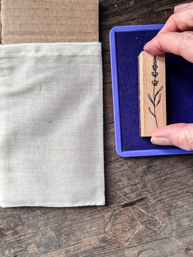 purple ink pad and a flower stamp