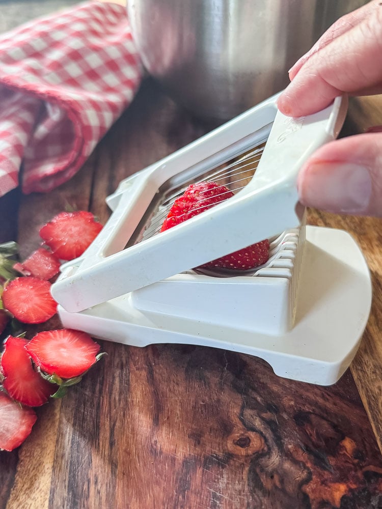 slicing strawberries with egg slicer