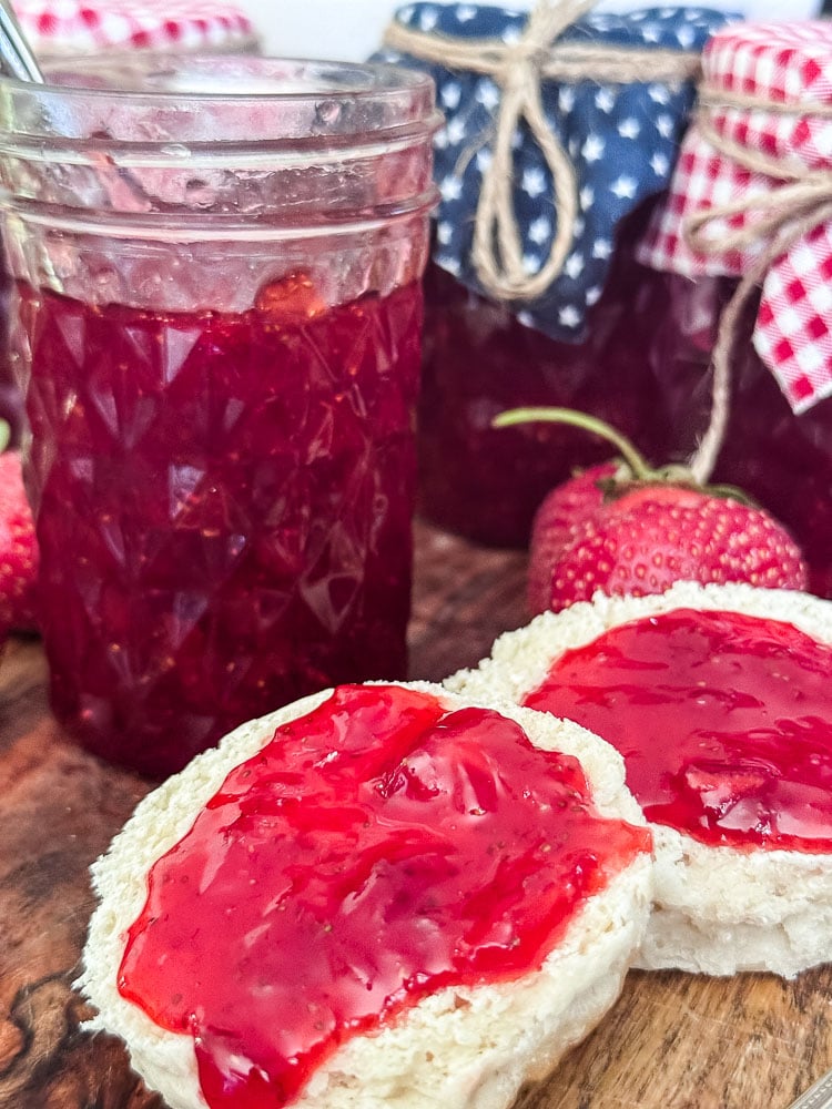 a biscuit slathered with strawberry jam