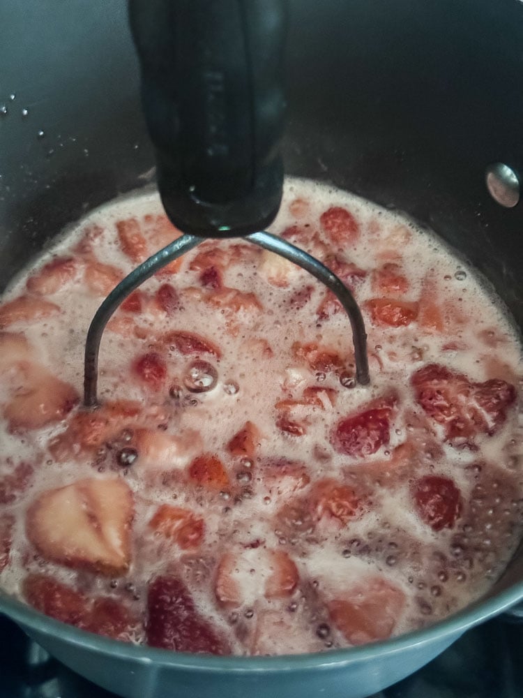 strawberries simmering in a saucepan