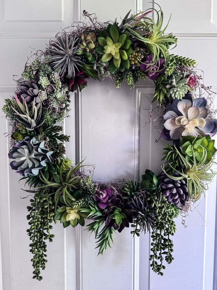 artificial succulent wreath on a door