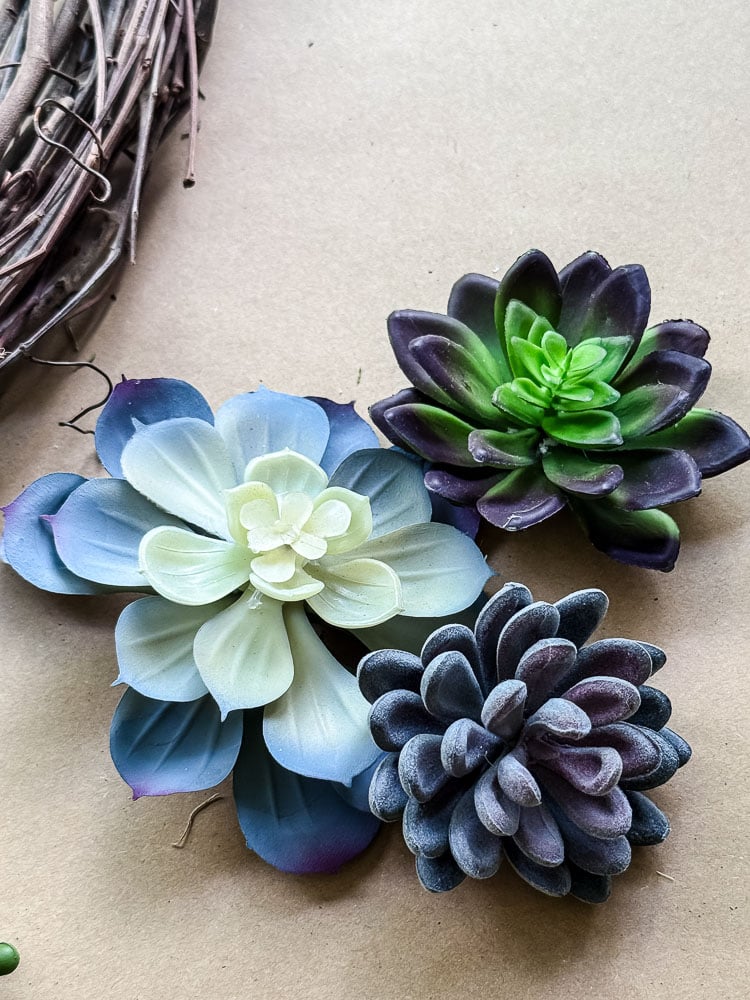 rosette artificial succulents on brown paper