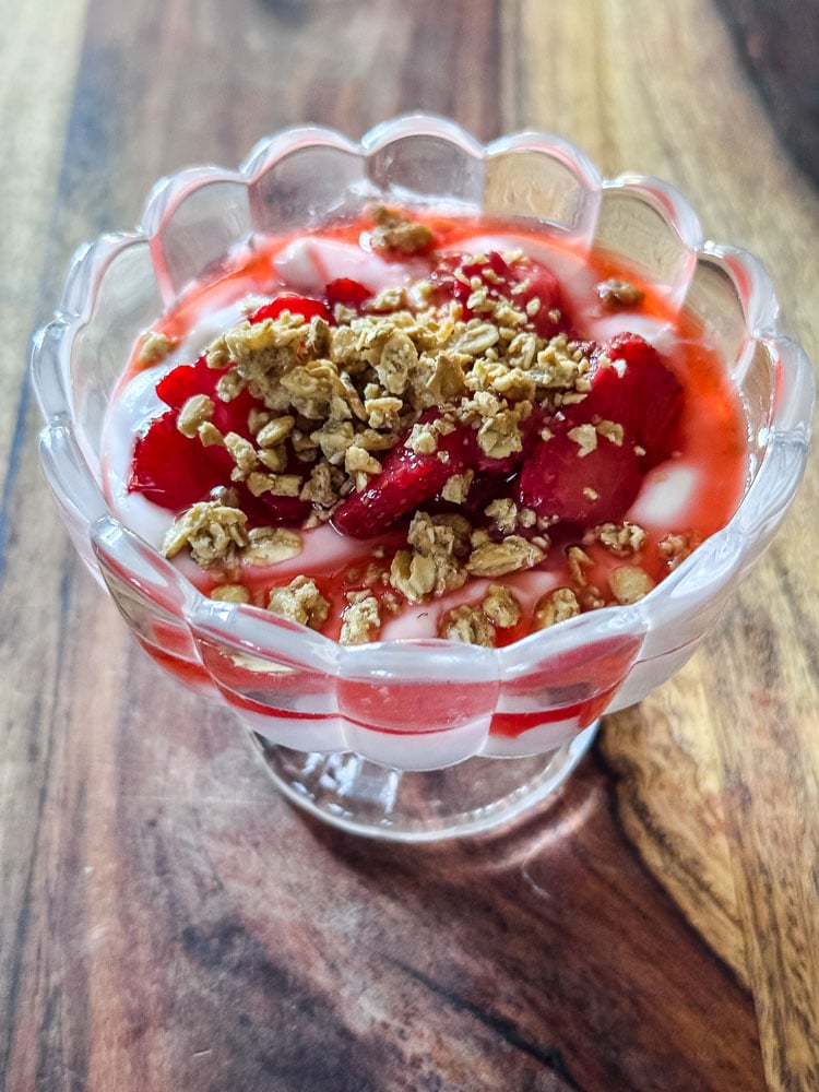 stawberries on top of yogurt with granola