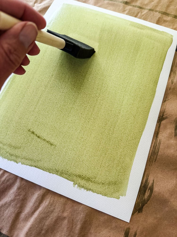 brushing cyanotype chemicals on paper
